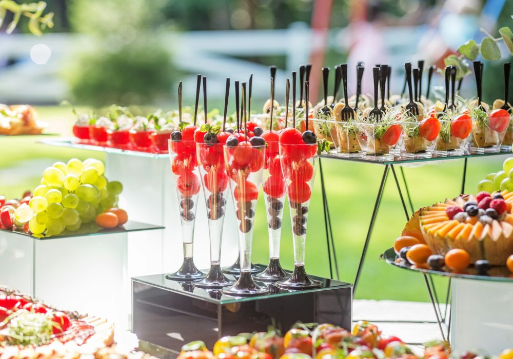 catering buffet table with snacks and appetizers.